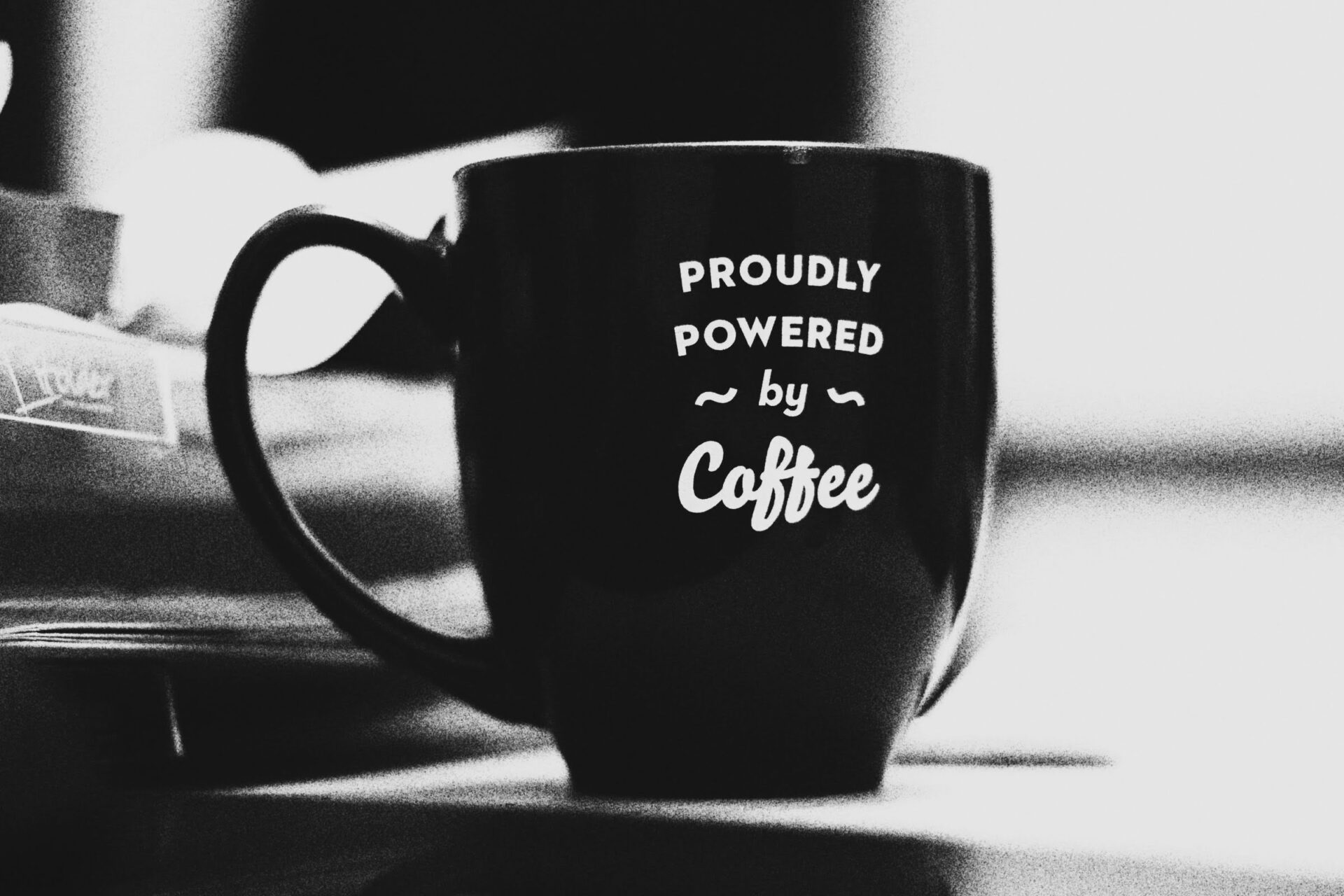 Image of a Coffee Cup showing "Prodly Powered by Coffee"